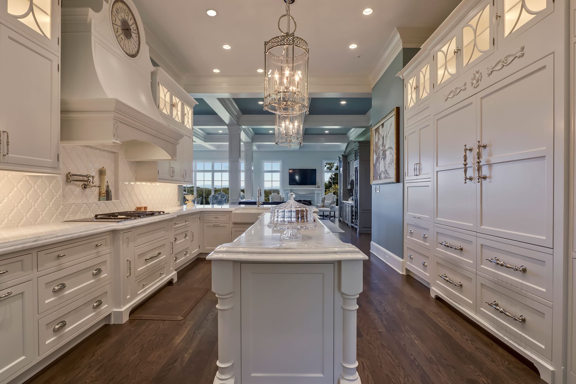 Formal White Kitchen With Custom Clock Hood